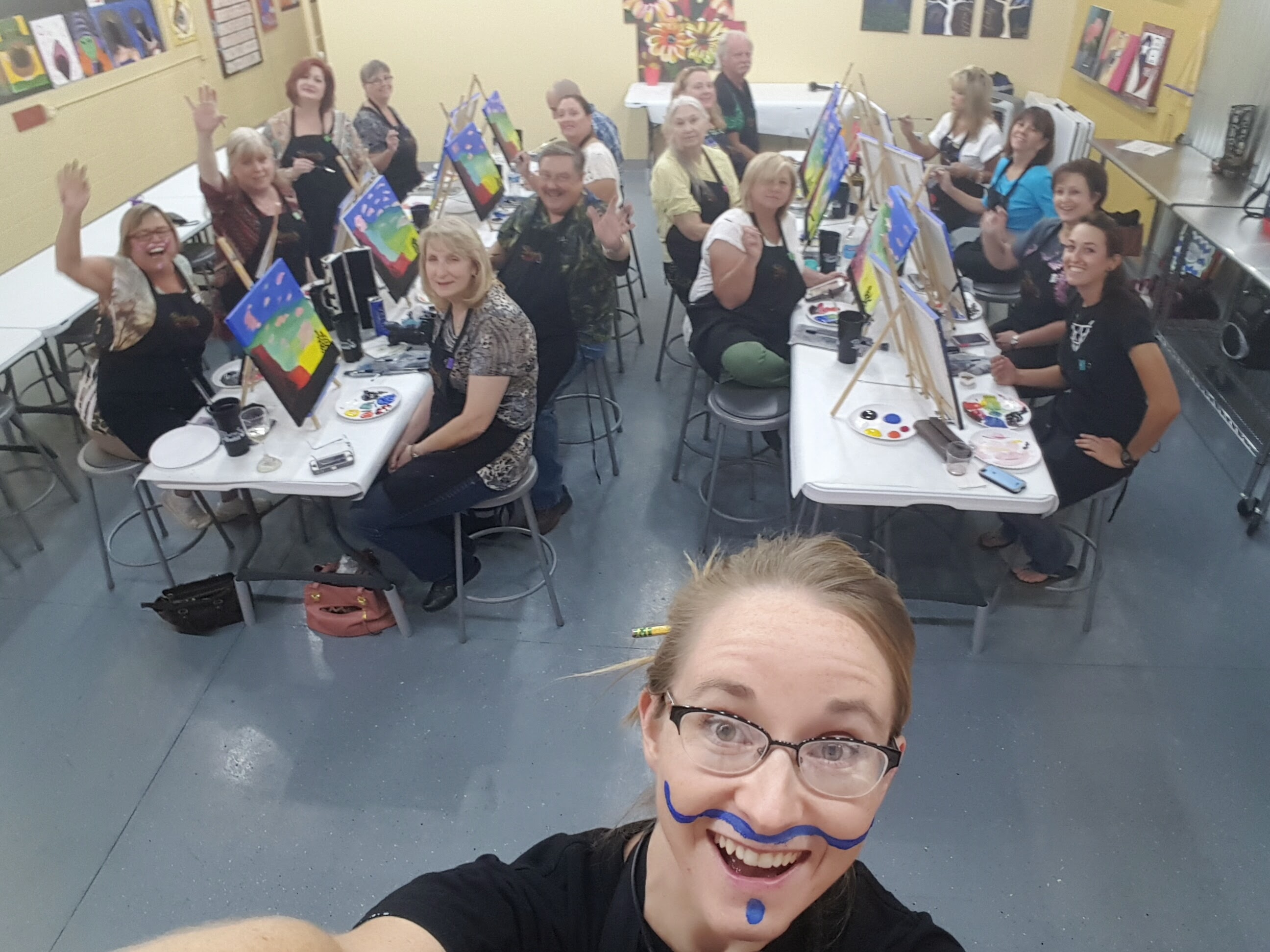 Artist Reagan Deming teaching a painting class